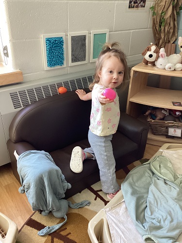A child showing that she found a hidden egg