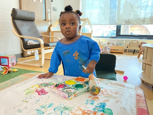 baby in blue painting