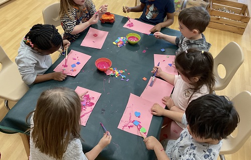 children at the table painting
