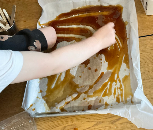 scooping syrup on cookies