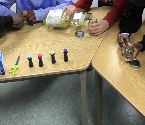 Children getting their glass bottle.